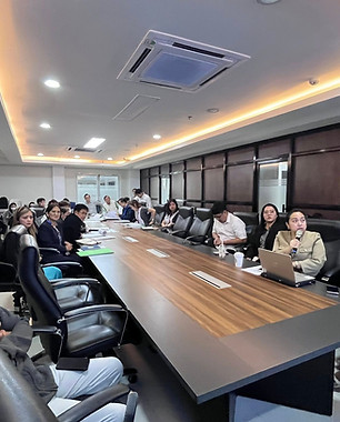 Group of people attending a presentation in a conference room