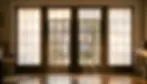 Properly installed cellular shades on French doors with outside mounting visible at frame edges