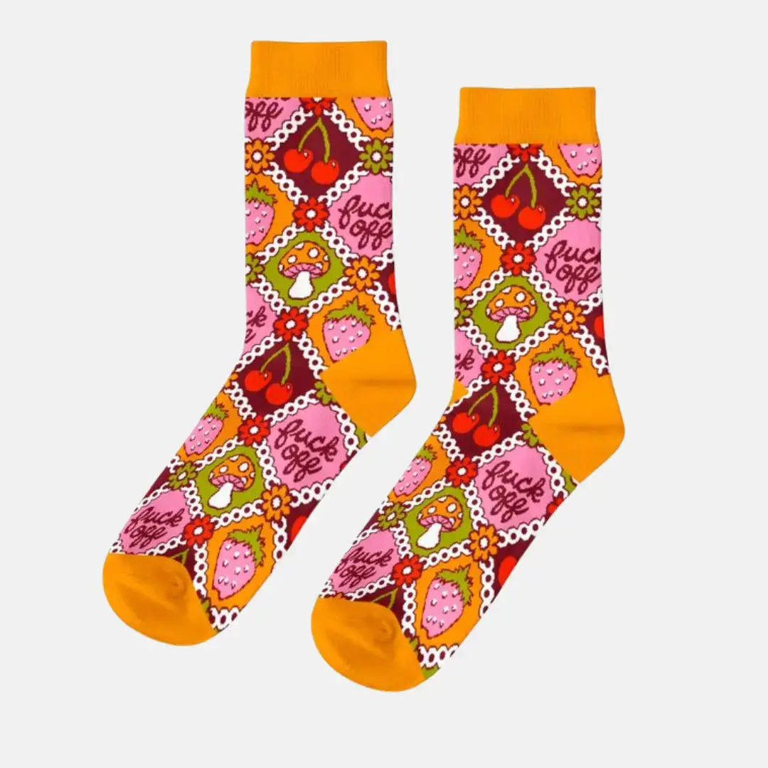 pair of crew socks with a colorful retro floral lattice pattern and a f*ck off message in a cursive script
