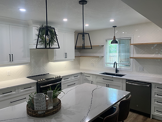 Herringbone backsplash. White subway tile with white grout.