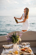Bride pops a champagne bottle