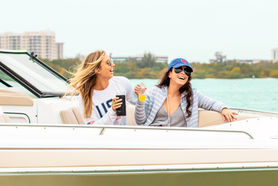 Women drinking champagne on Formula 31 bowrider boat in Siesta Key, Florida.