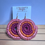 Thumbnail: Large pink on orange on purple Gani earrings