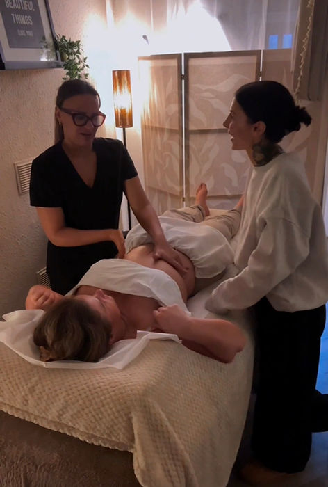 Post operative massage being taught to a student