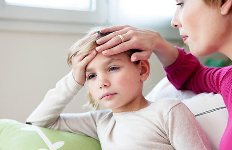 a-child-with-epilepsy-getting-comforted-by-her-mother.jpeg