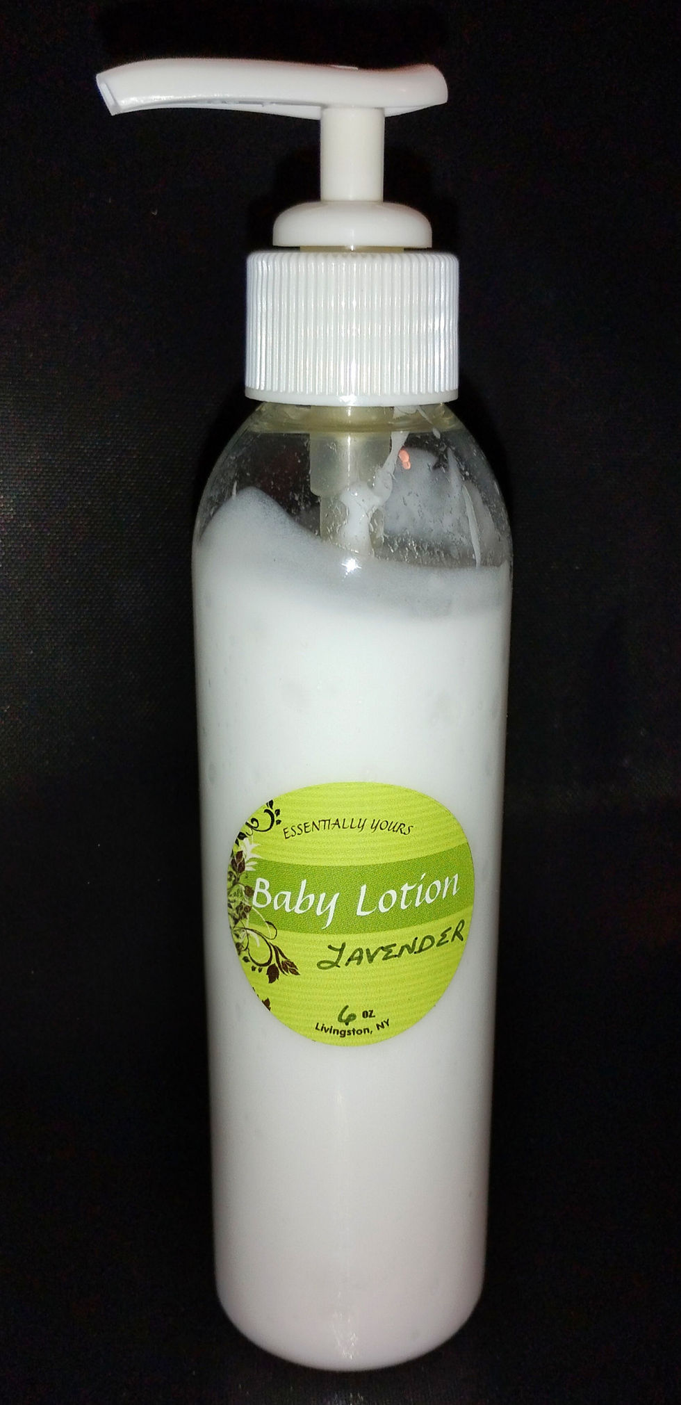 All Natural white Baby Lotion in a clear bottle with pump 
