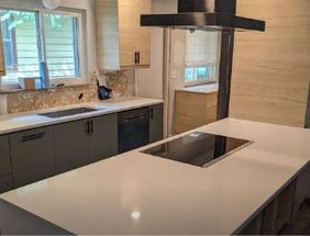 midcentury kitchen with light wood upper cabinets