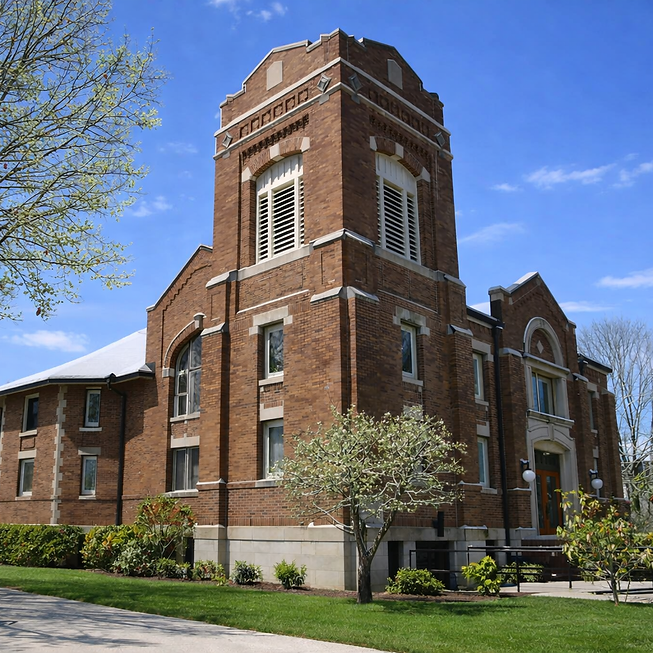 Red brick church under clear sky (1).png