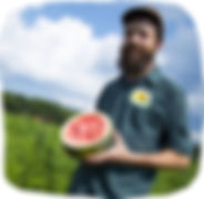 Zeb Baccelli of Clarion River Organics holds watermelon at Amish farm