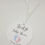 Thumbnail: This image shows the personalised baby showers circle tags with ribbons for gender unknown.