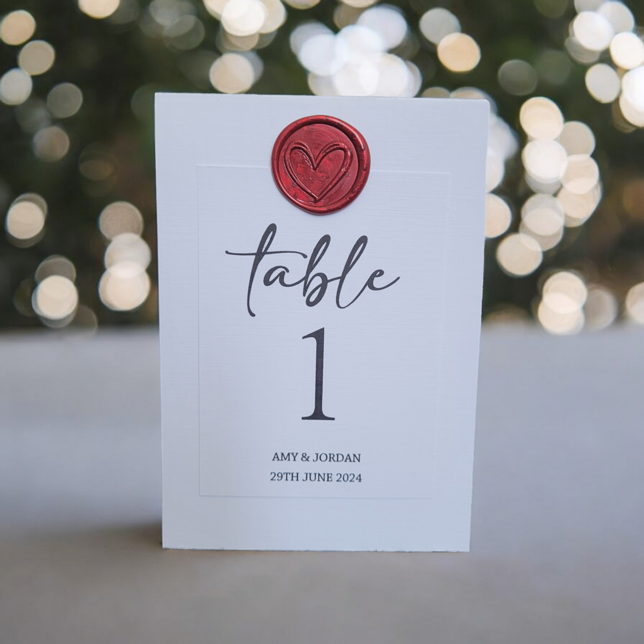 Black & White Design Table Number Tent Card with Wax Seal. White Tent Card with Black print & Red Wax Seal.
