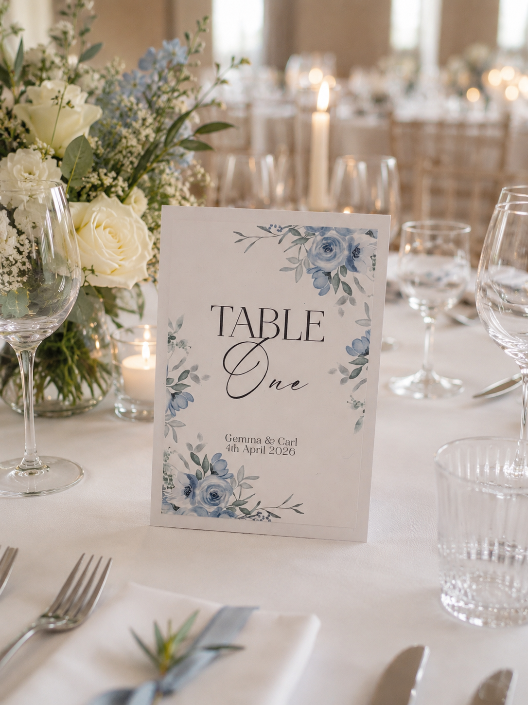 This image shows the Personalised Dusky Bloom Table Number with a modern script font and Dusky Blue Floral illustration.