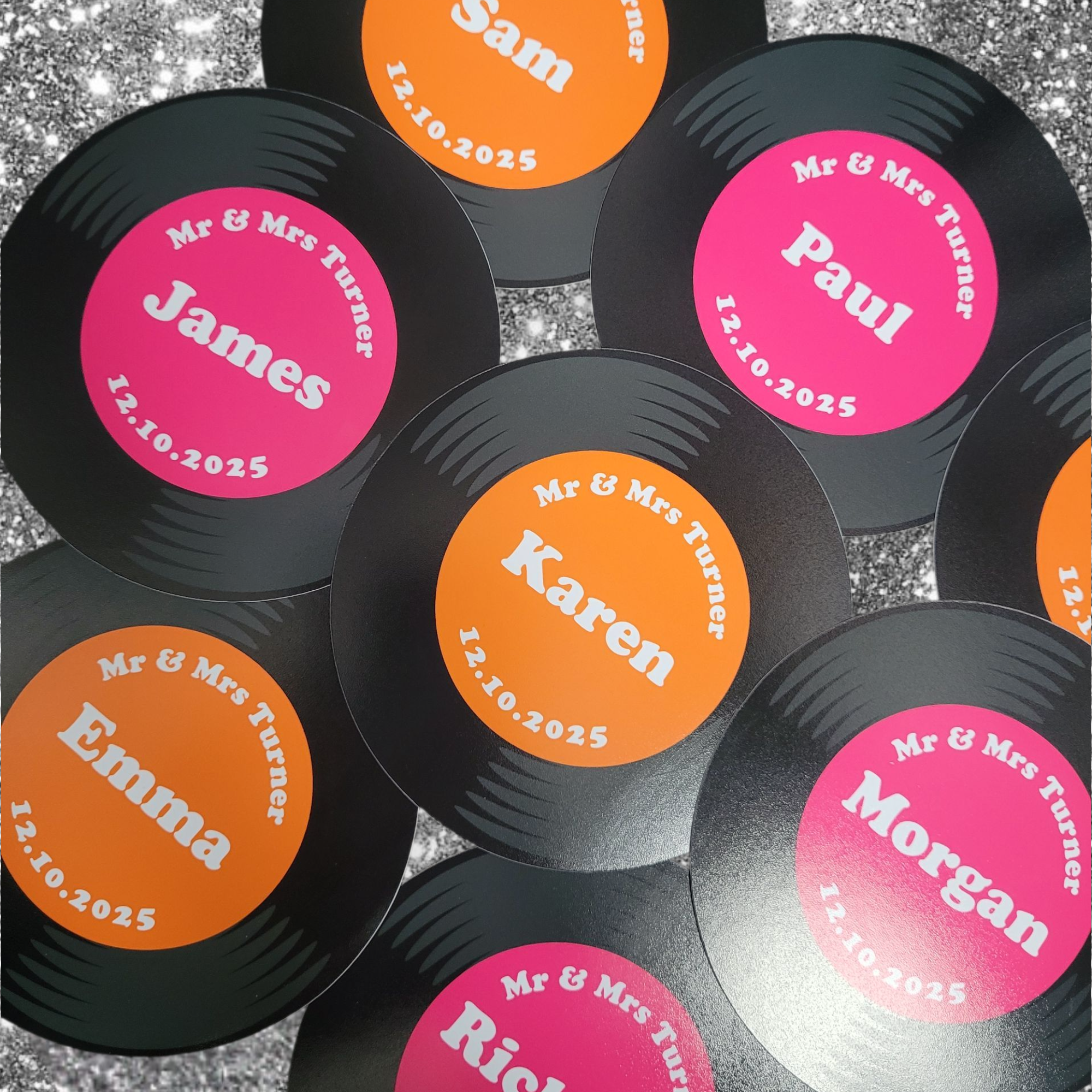 Retro Disco Mini Record Name Place Cards in vibrant Orange & Pink.