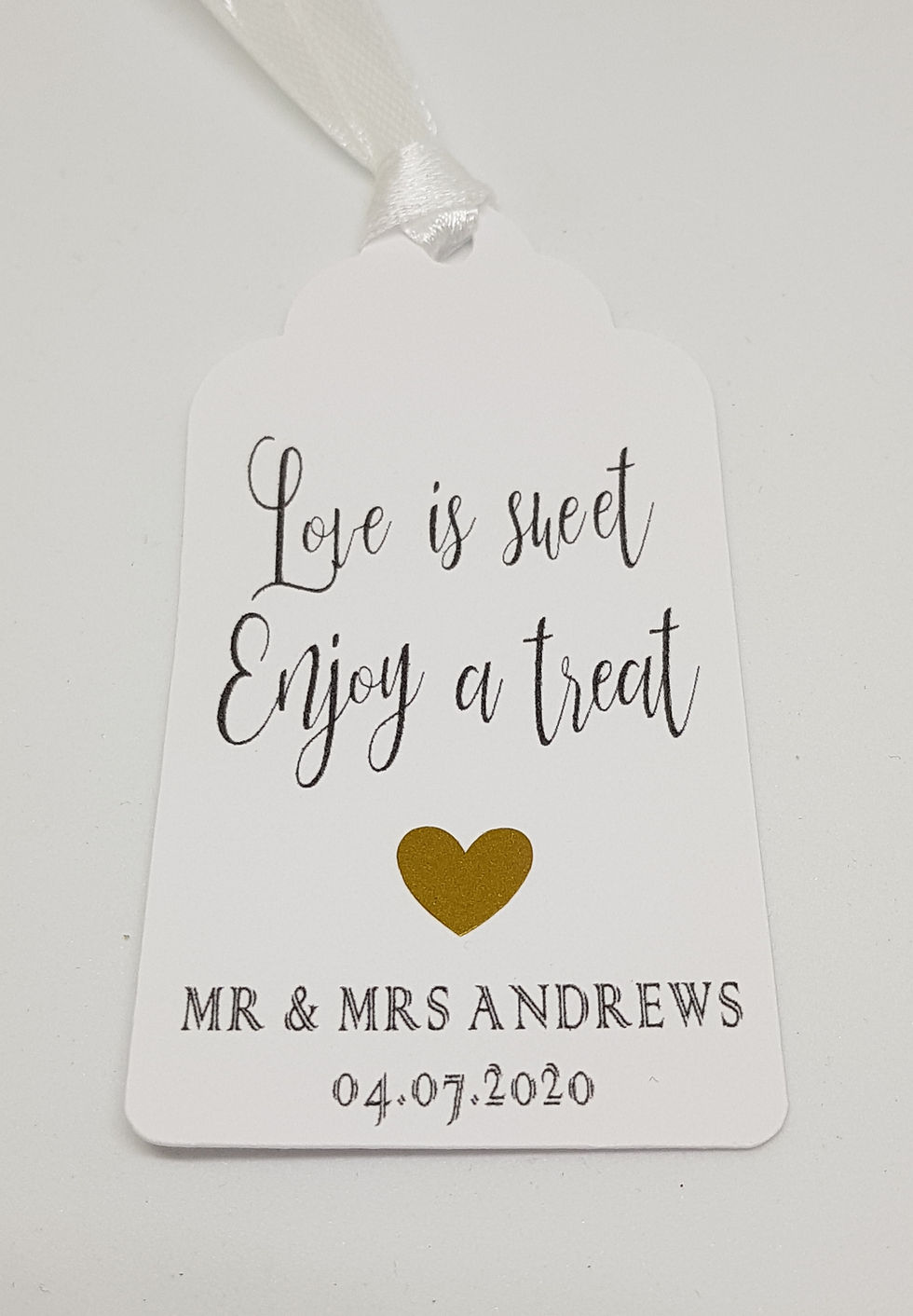 Thumbnail: Love is Sweet, Enjoy a Treat Tag with ribbon and a gold heart. Your Names and Wedding Date are at the bottom.