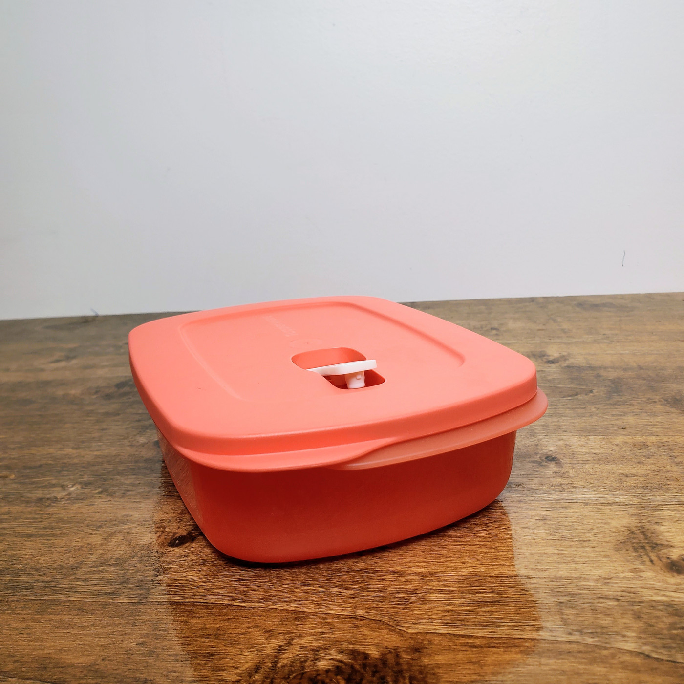 Coral Tupperware CrystalWave Plus Rectangle Microwave Container with stain guard.