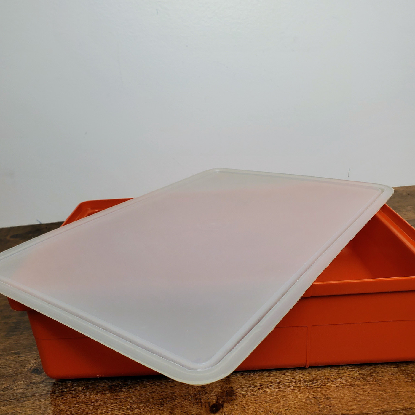 Authentic vintage Paprika Red Tupperware craft storage container with clear lid.