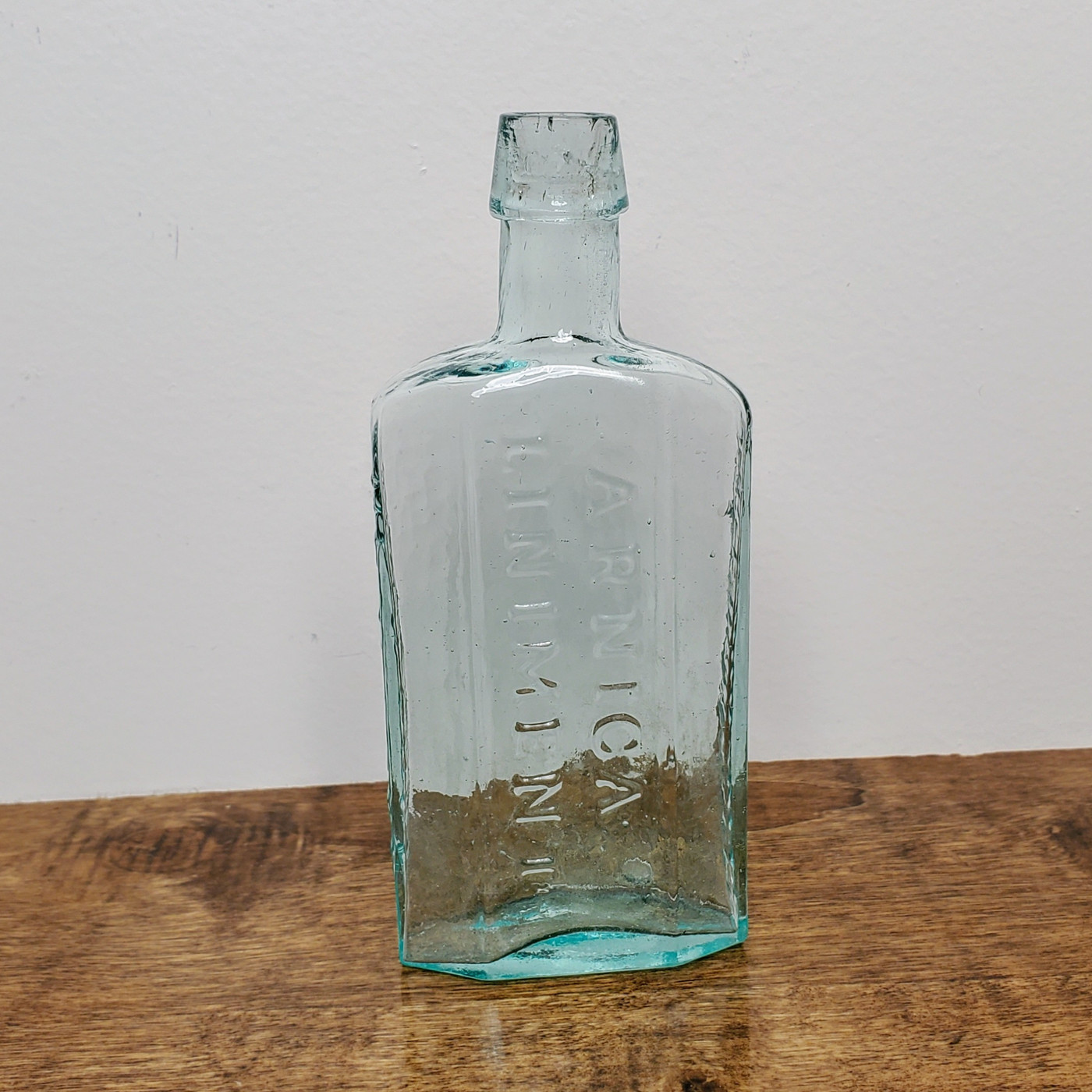Aqua bubble glass top Burdsalls Arnica Liniment New York medicine bottle.