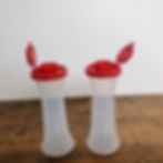 New Tupperware Large Hourglass Salt and Pepper Shakers – Clear with Red Lids