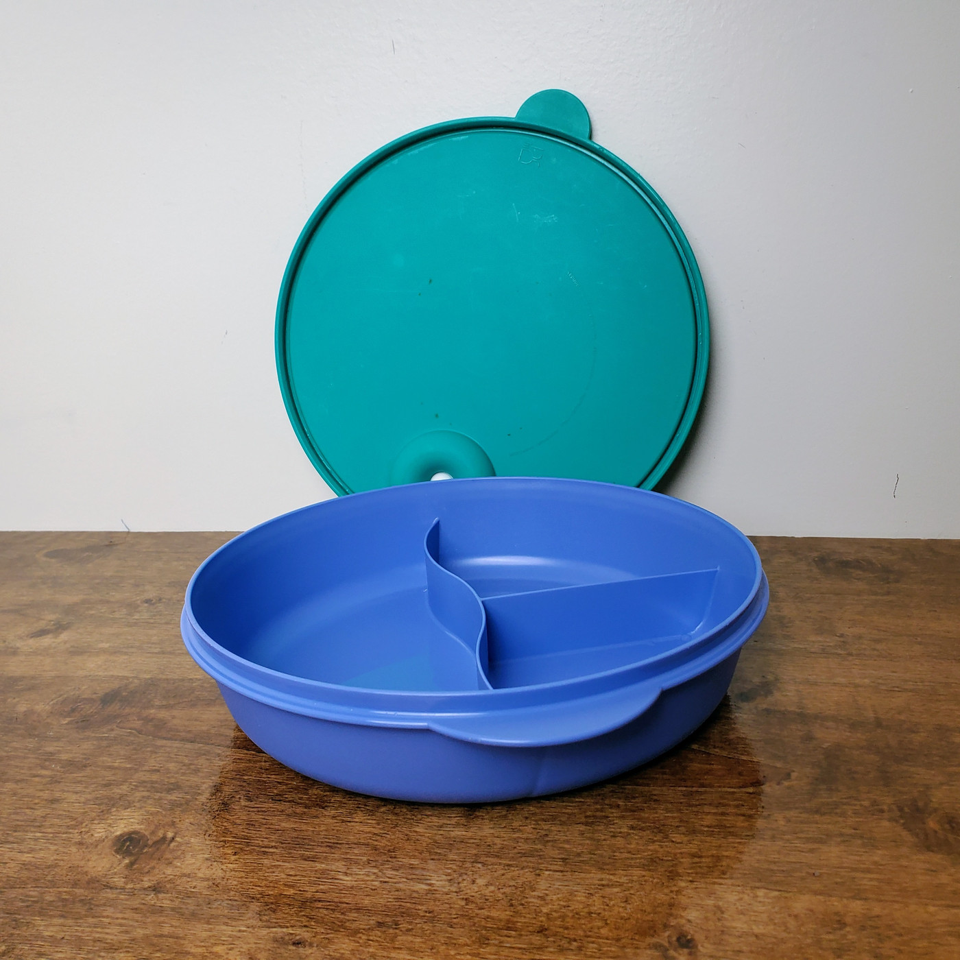 Divided CrystalWave microwave dish with blue and teal vented lid.