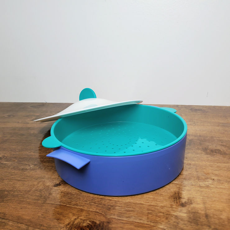 A collection of colorful vintage Tupperware mugs neatly arranged on a clean wooden surface.