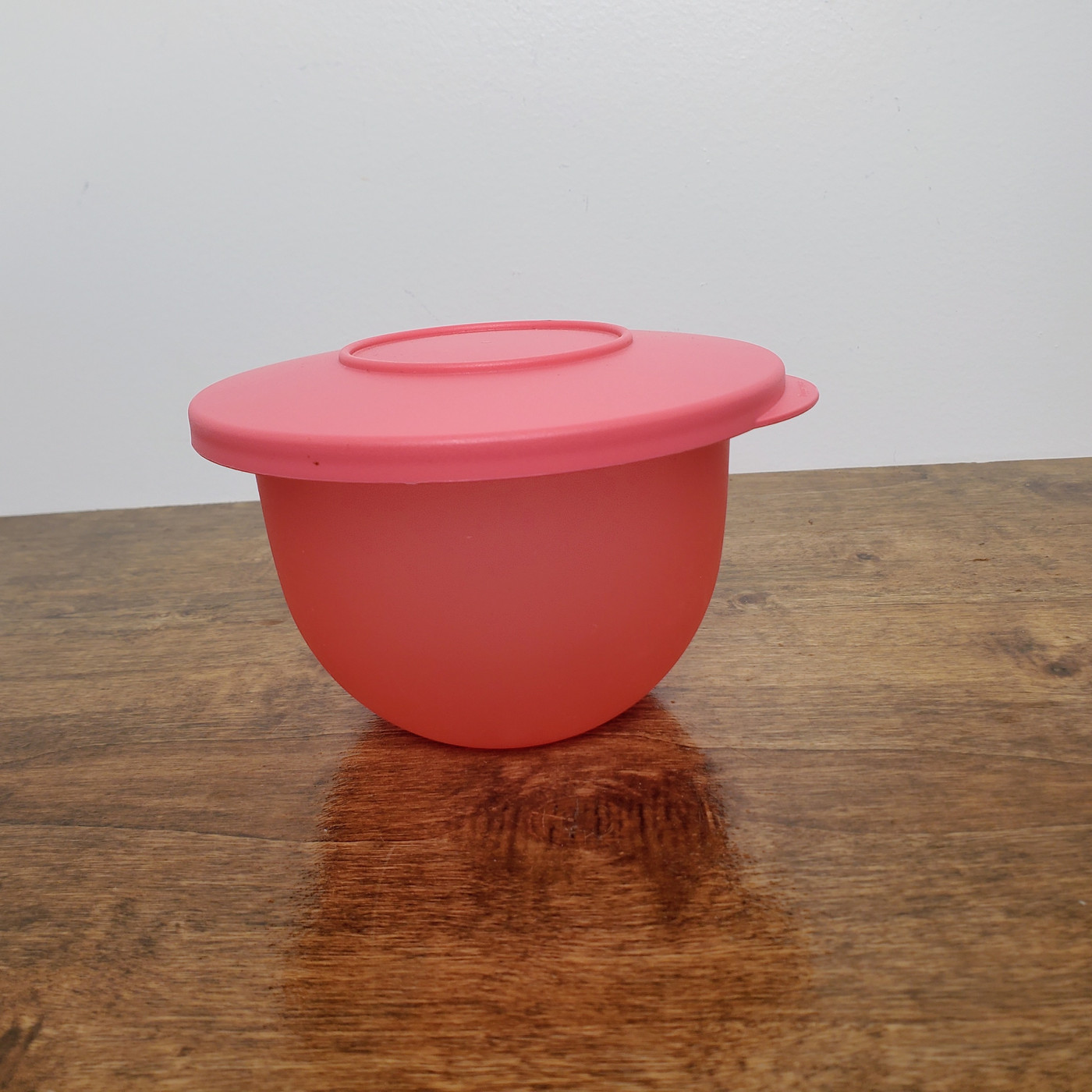 Red Tupperware Impressions mini bowl with matching lid.