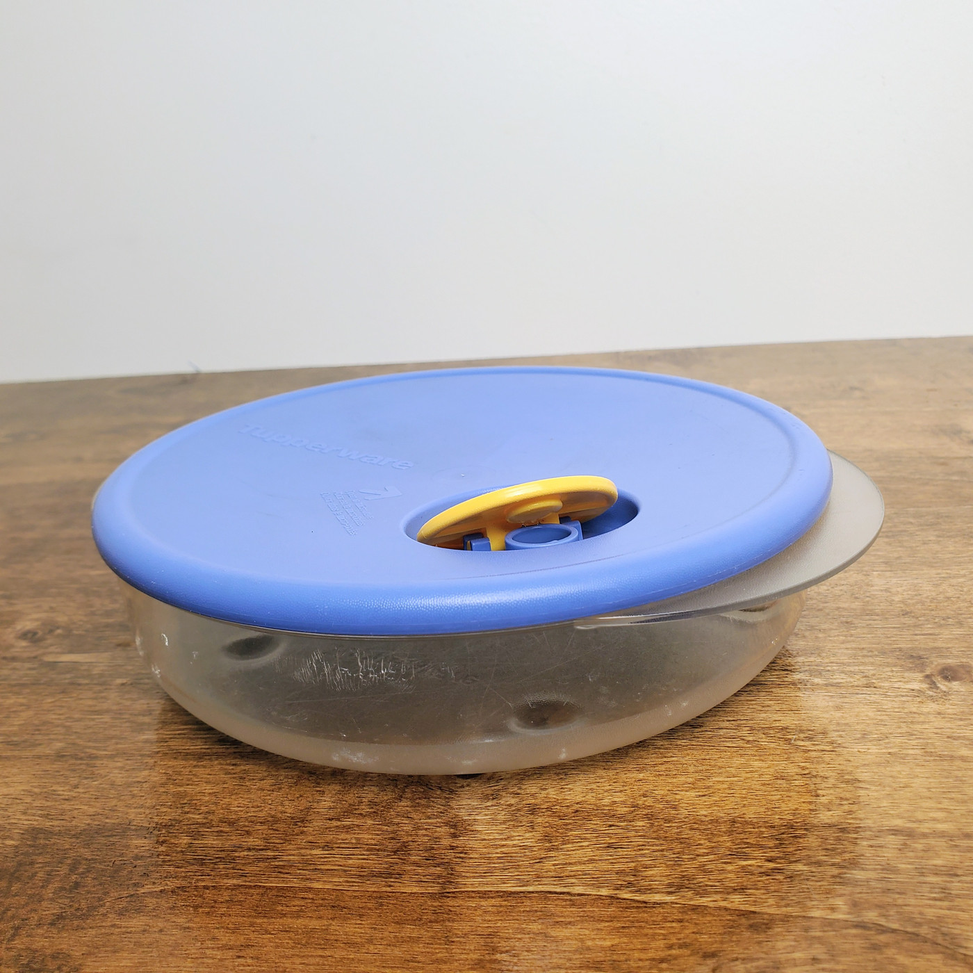 Vintage Rock N Serve divided microwave container with blue vented lid.