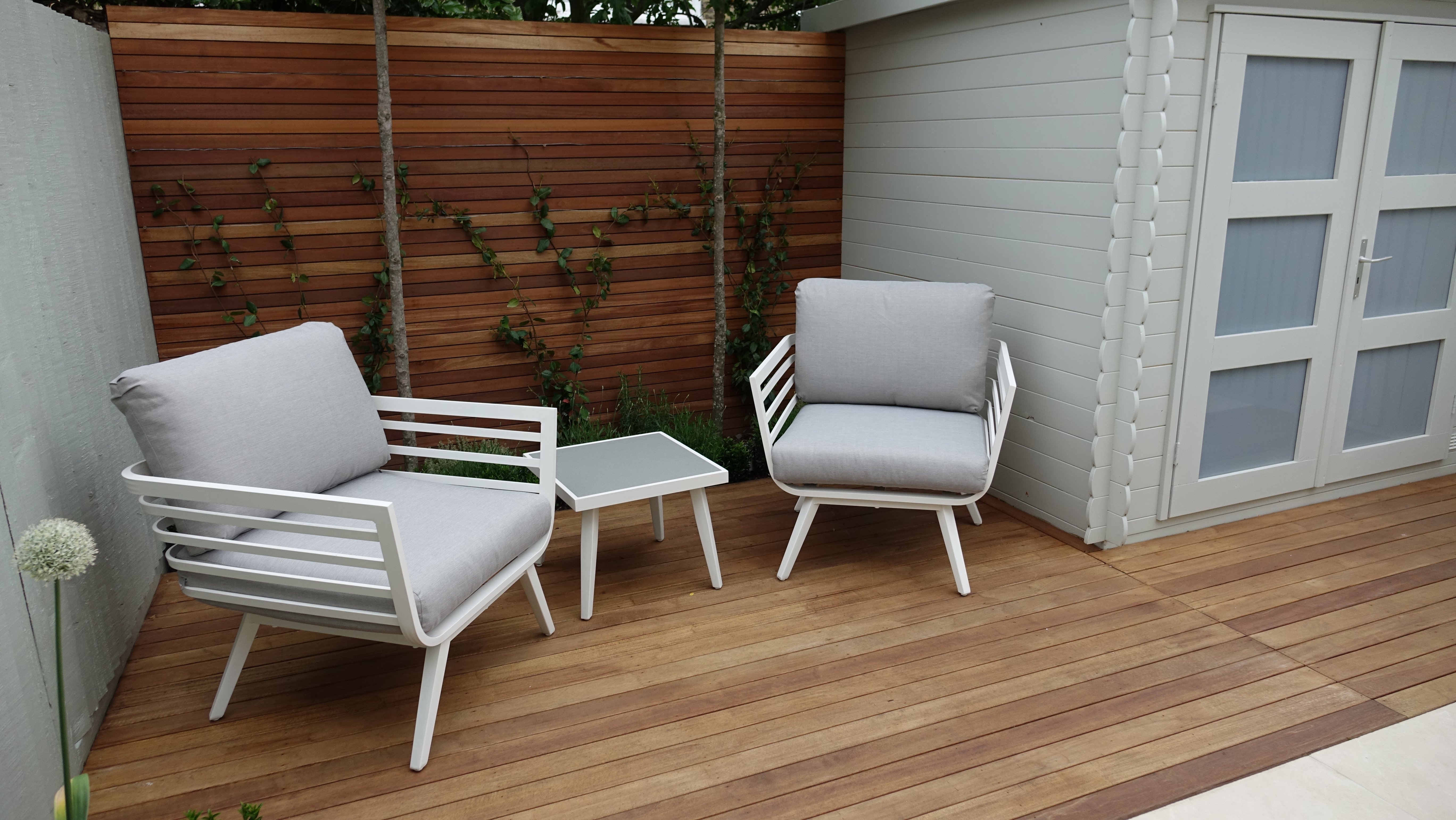 informal seating area in modern garden d