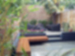 modern-garden-design-london-natural-sandstone-paving-patio-design-hardwood-floating-bench-grey-blcok