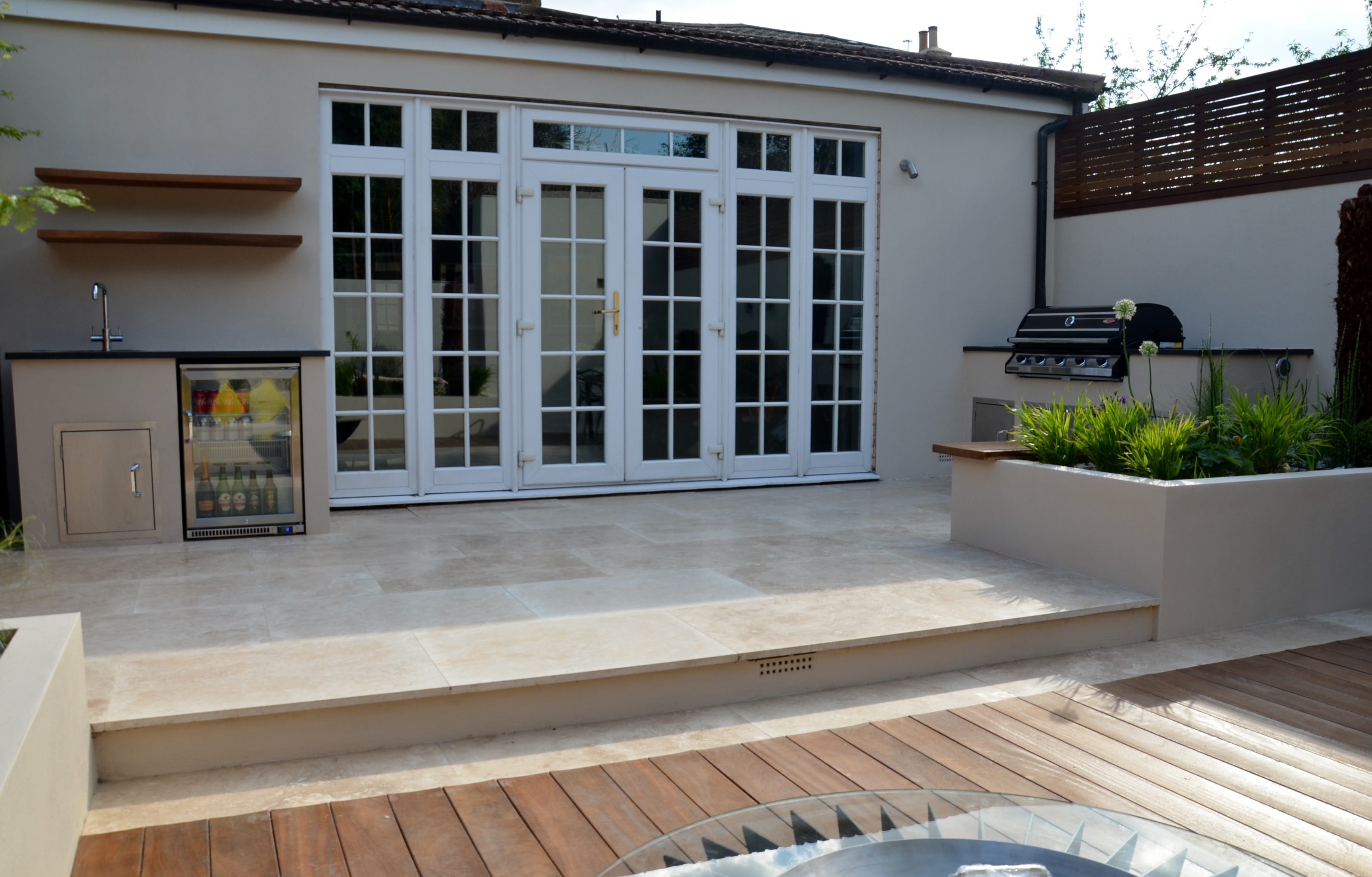 modern garden design outdoor room with kitchen seating epsom