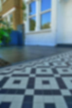 black and white victorian mosaic tile path