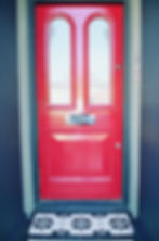 Victorian restoration with modern twist red door with porch mosaic