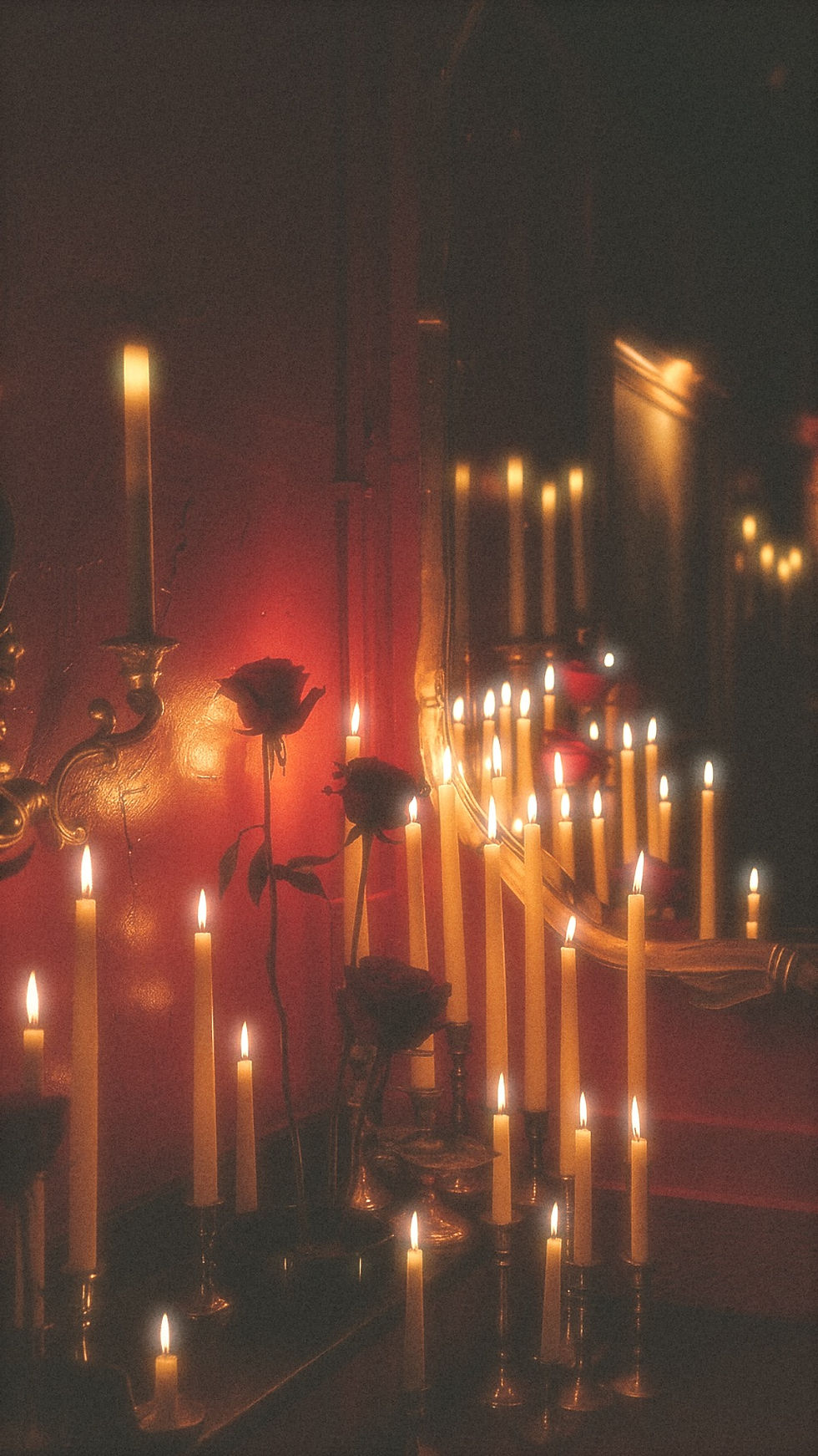 Exclusive dark floral gourmand fragrance styled with dramatic candle lighting