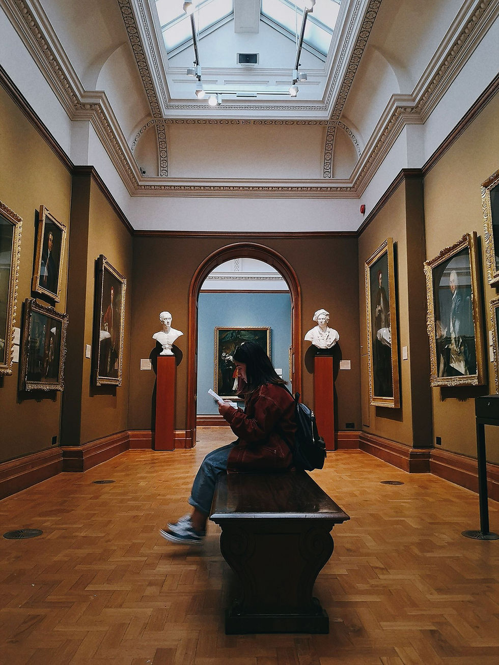 Me sitting in the National Portrait Gallery of the UK