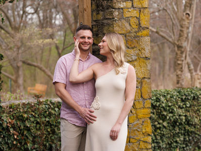 Couple elegantly posing in a whimsical garden