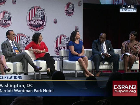 A group of panelist on stage