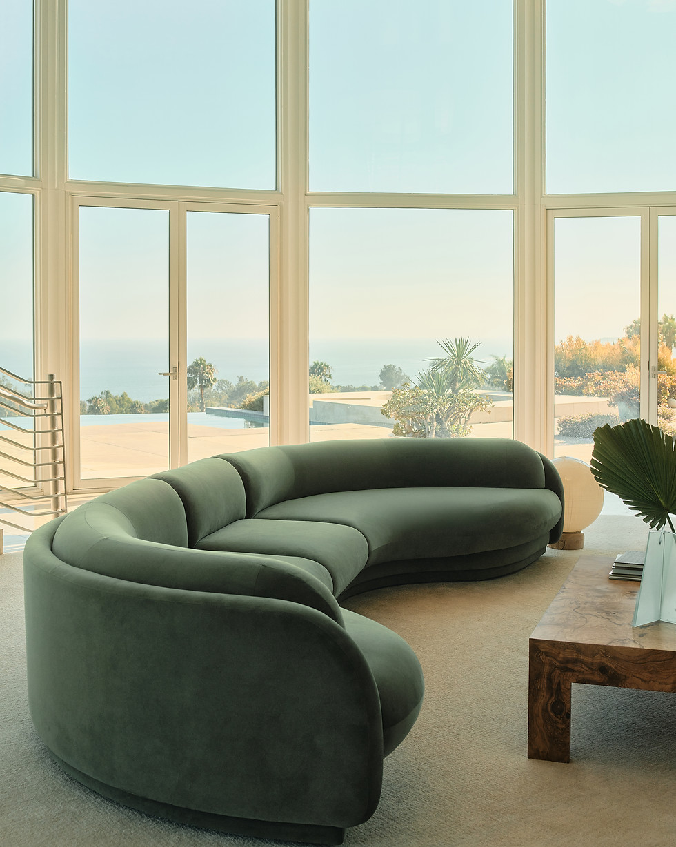 Green Poet Sofa by Tiffany Howell in a sunlit Malibu living room