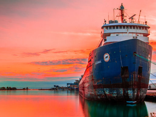 Cargo tanker ship crossing the Strait of Hormuz at dusk