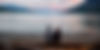 man in white shirt sitting on brown wooden dock during daytime_edited.jpg