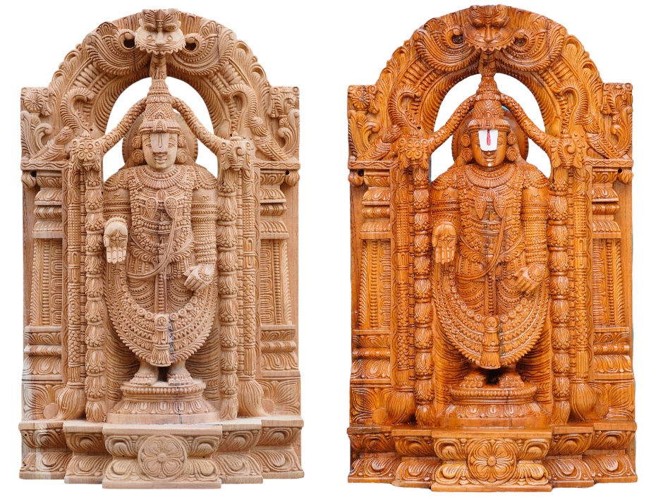 Two intricately carved wooden statues stand side by side, depicting deities with detailed patterns. One is light wood, the other darker.