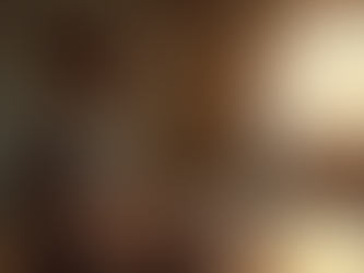 Close-up view of a person meditating with eyes closed in a quiet room