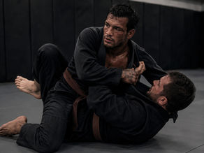 BJJ fighters sparing on a mat