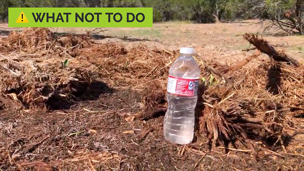 Plastic water bottle on dry grass and dirt. Green warning label reads "WHAT NOT TO DO." Trees in the distant background.