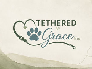 Tethered by Grace Inc. logo featuring a heart-shaped dog leash, paw print, and soft watercolor background with botanical accents, representing the nonprofit’s mission of connecting dogs with opportunities to serve and support their communities.