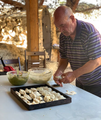 Our master pastizzi maker fills a tray full of handmade pastizzi ready to be baked during the pastizzi experience tour