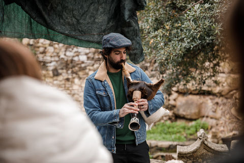 Our expert musician plays the Maltese bagpipe in front of a group of tourists during the traditional Maltese music demonstration tour