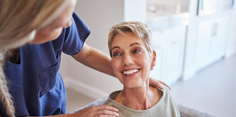 woman talking with elderly woman