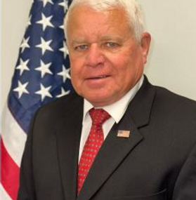 A professional head shot photo of District 4 Commissioner Truman Boyle