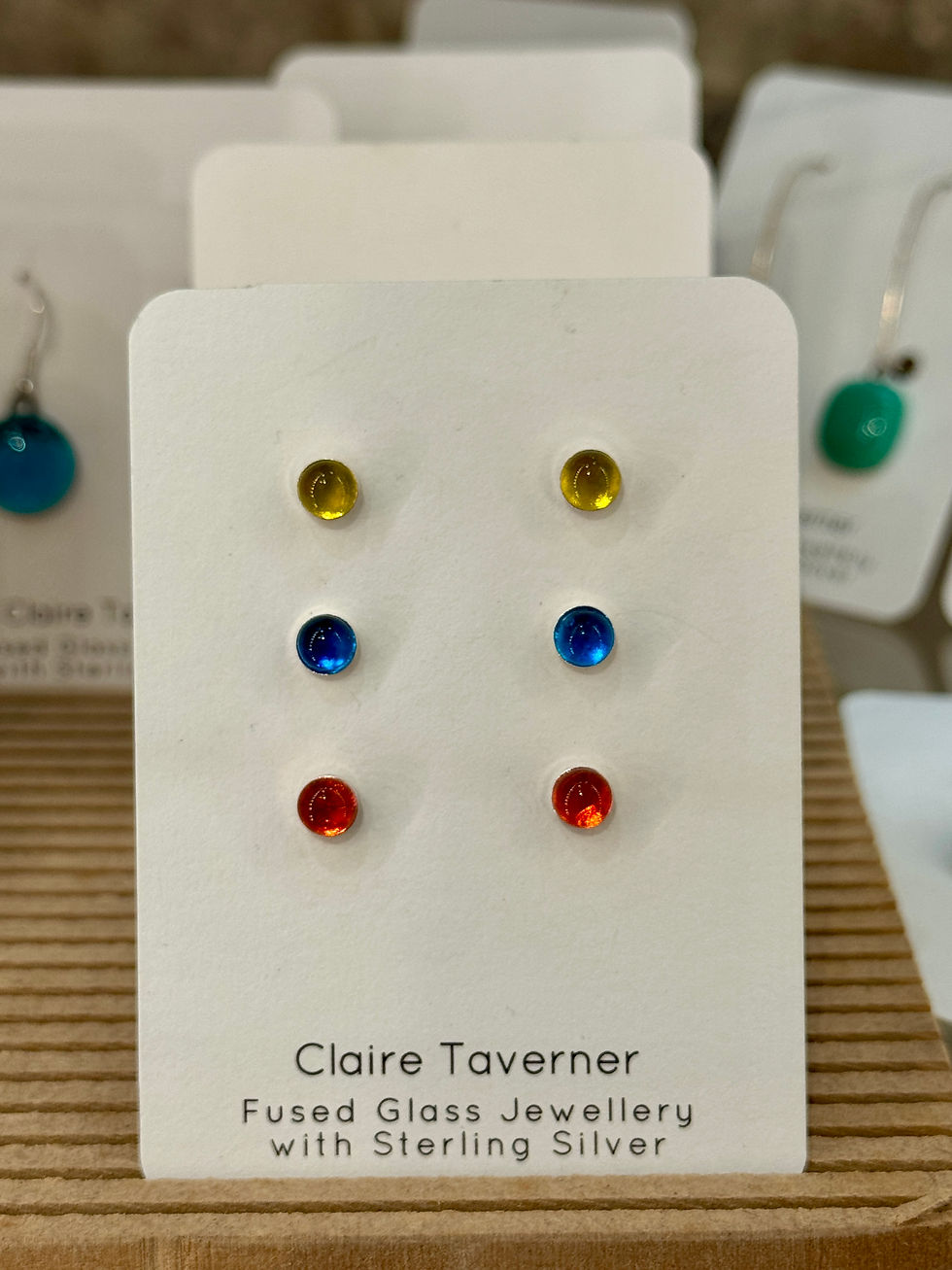 Thumbnail: three pairs of earrings in different colours on a white card