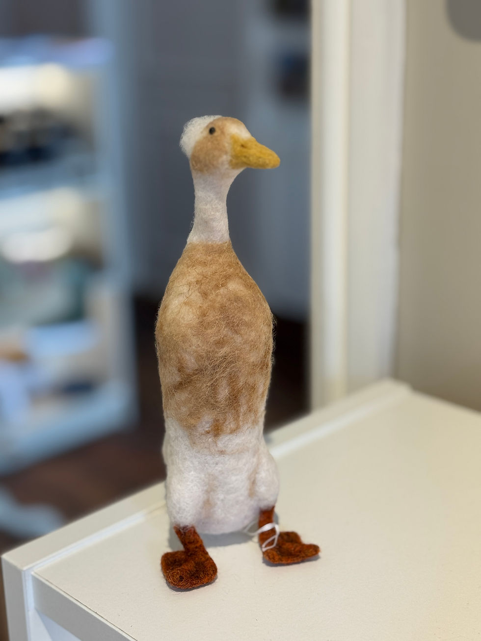 felted runner duck stood up tall with yellow beak