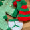 Thumbnail: Tiny knitted Elf outfit hanging on a washing line